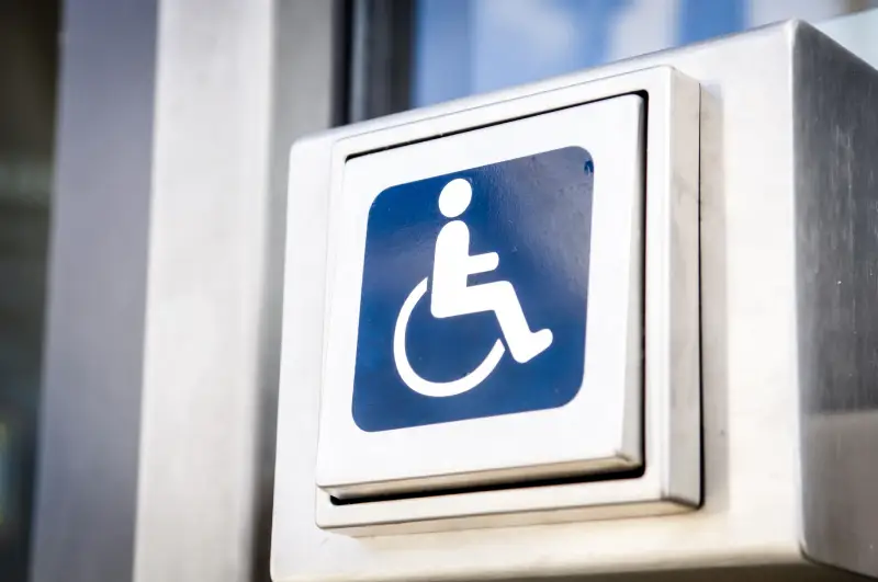 ADA Compliance for Businesses door opener button for disabled people at an office building<br />